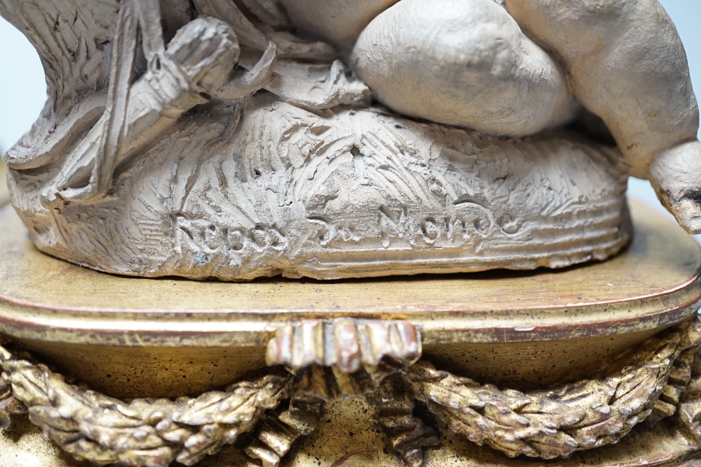 Two 19th century French terracotta cherubs and one other Cupid, after Clodion, all on giltwood stands, tallest 23.5cm